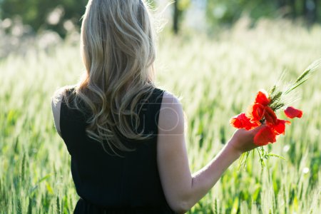 Woman collecting flowers outdoor