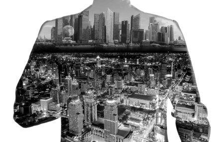 Double exposure of businessman and the city.