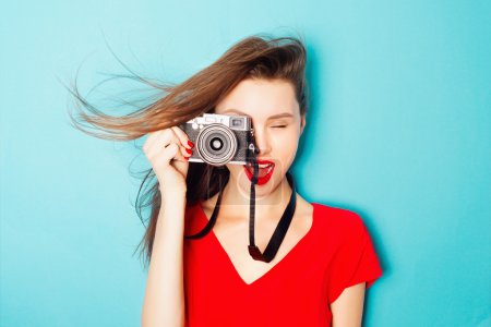 brunette woman  with a camera