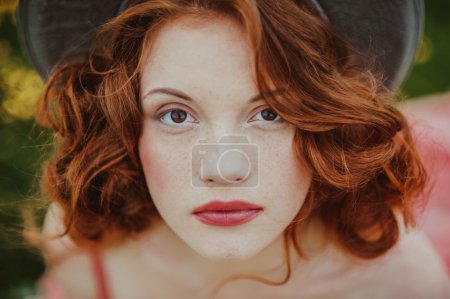 Portrait of a young redhead woman