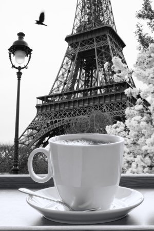 Eiffel Tower with cup of coffee in black and white style, Paris, France
