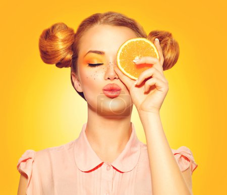 model girl takes juicy orange
