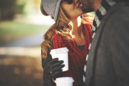 Couple kissing in  autumn park