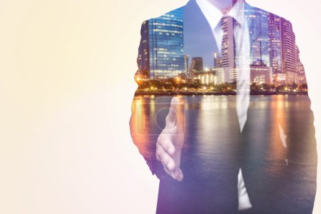 Double exposure of business man and city