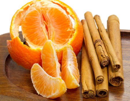 Orange with cinnamon sticks