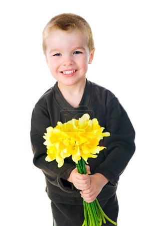 Cute little boy giving flowers