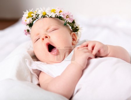Portrait of a yawning baby girl