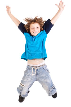 Young and attractive kid jumping high