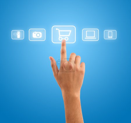 Hand pressing shopping cart symbol from media icons on blue back