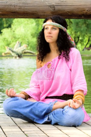 Hippie woman meditating