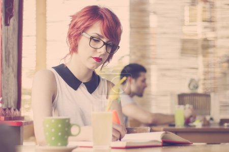 Cute hipster girl studying. Retro tones