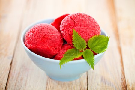Strawberry ice cream in blue bowl