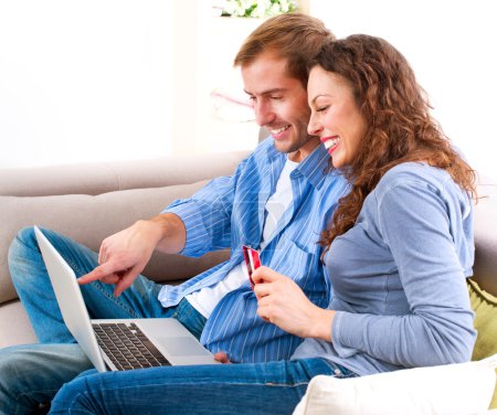 Online Shopping. Couple Using Credit Card to Internet Shop