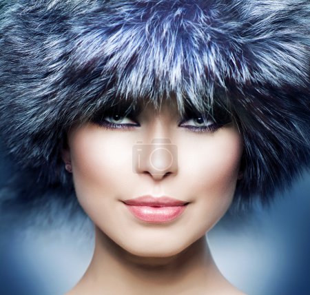 Fashion. Beautiful Girl in Fur Hat. Winter Woman