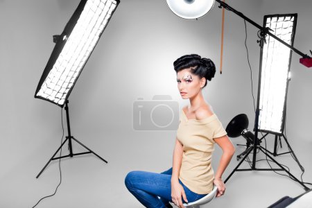 young model posing in professionally equipped studio