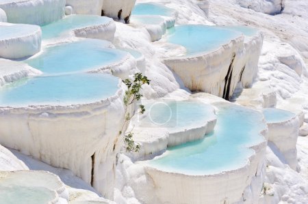 Blue water travertine pools at Pamukkale, Turkey