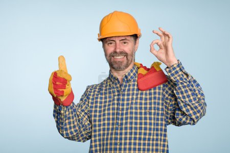 Happy builder with thumbs up gesture