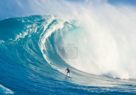 MAUI, HI - MARCH 13: Professional surfer Billy Kemper rides a gi