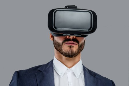Male in a suit with virtual reality glasses