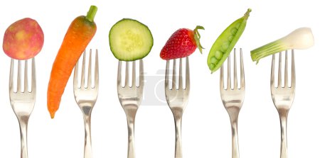 Vegetables and fruits on the collection of forks, diet concept