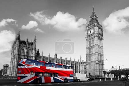 Big Ben with city bus covered flag of England, London, UK