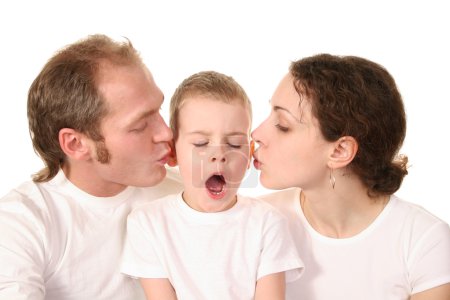 Yawn boy with kissing parents
