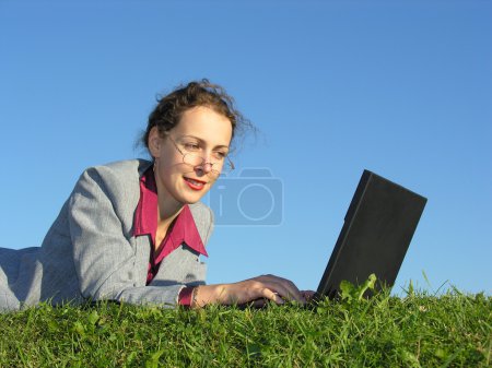 Businesswoman face with notebook on blue sky