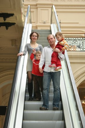 Family of four on escalator