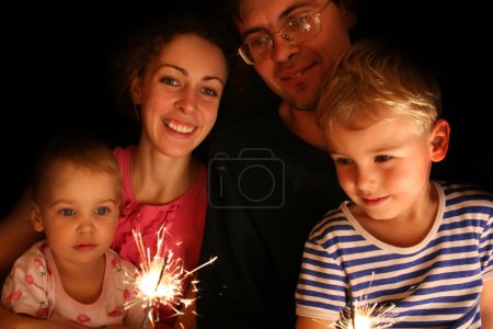 Family with sparkler