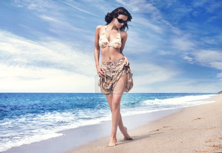 Beautiful woman on tropical beach