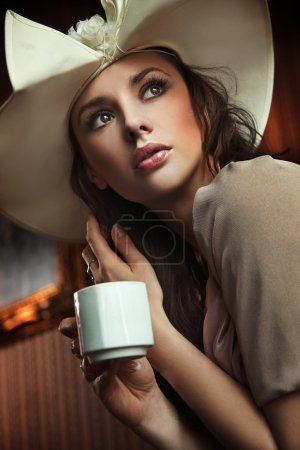 Portrait of a beautiful lady drinking afternoon coffee