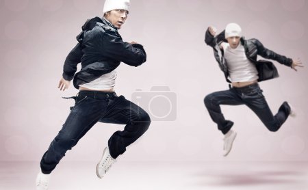 Abstract studio photo of two hip hop dancers