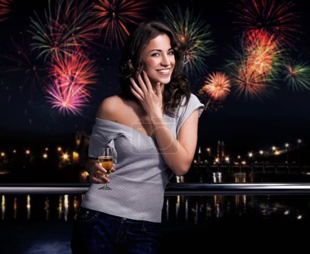 Beautiful brunette on a fireworks background