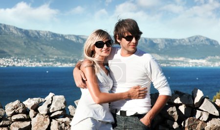 Smiling young couple with sunglasses