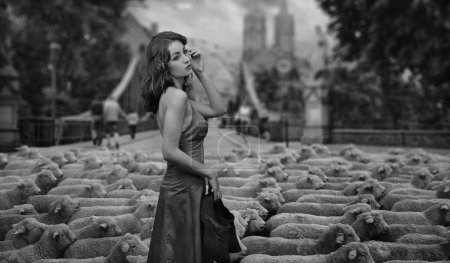 Fine art photo - brunette as a shepherd in an urban scenery