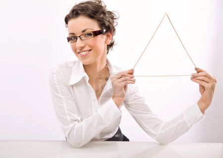 Young businesswoman holding a triangle symbol