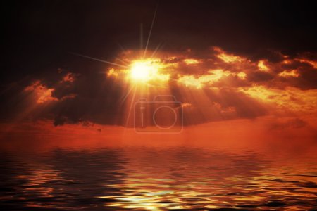 Hot sunset over water surface
