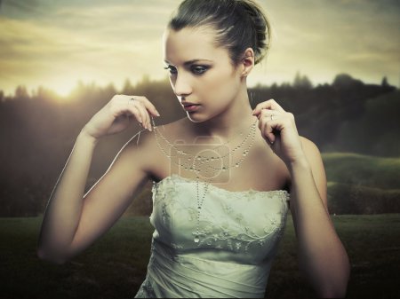 Fine art photo - young lady wearing a necklace of morning dew