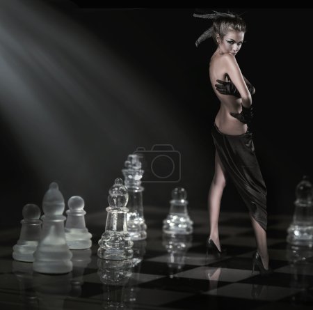 Pretty brunette standing on a chessboard
