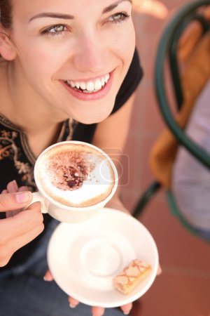 Young woman enjoying coffee break
