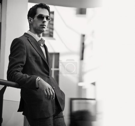 Vogue style black white photo of an handsome businessman