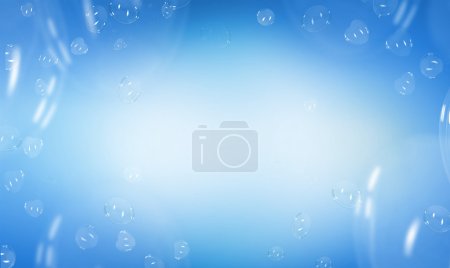 Heart shaped soap bubbles over blue background