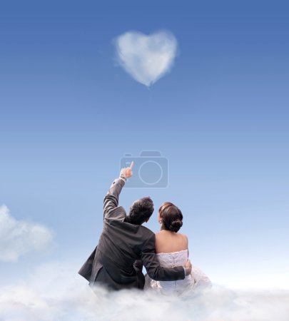 Heart of cloud - studio shot of a wedding couple