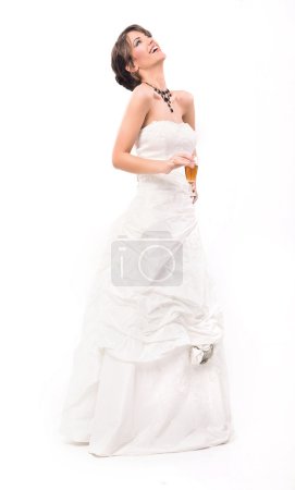 Young smiling bride with glass of champagne