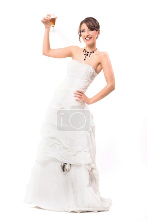 Young smiling bride with glass of champagne