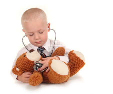 Doctor With Stethoscope and Teddy Bear as a Pati