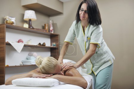 Woman at spa and wellness back massage