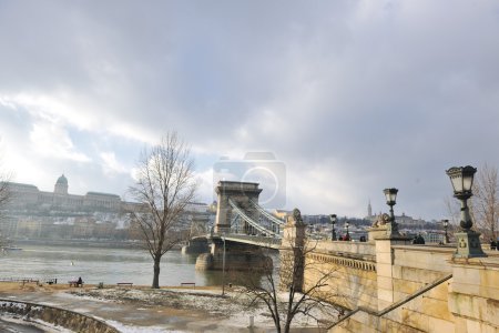 Old budapest chain bridge at day on danube river