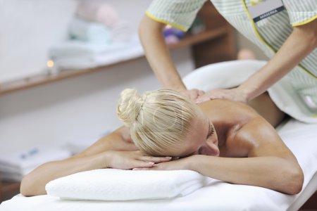 Woman at spa and wellness back massage