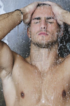 Good looking man under man shower